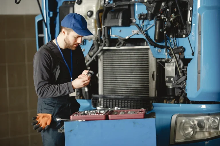men repair truck man teaches repair car two men uniform