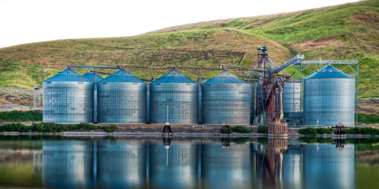 panoramic shot industrial buildings shore lake reflected water