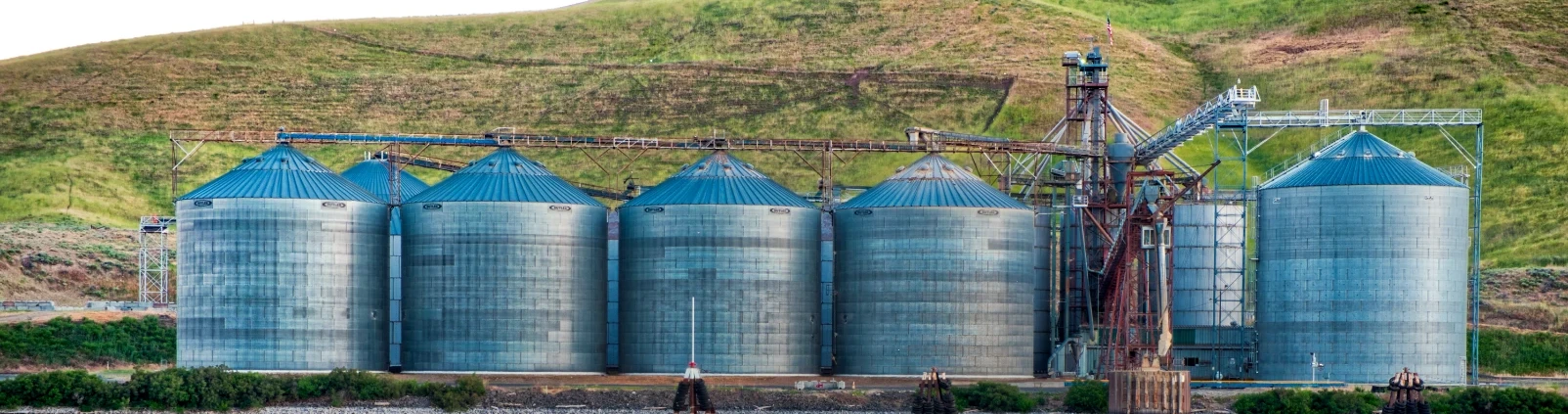 panoramic shot industrial buildings shore lake reflected water cropped