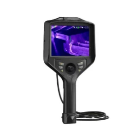 Ergonomic joystick-controlled industrial borescope with integrated UV illumination, touch screen displaying live fluorescent penetrant crack inspection footage of internal metal structures
